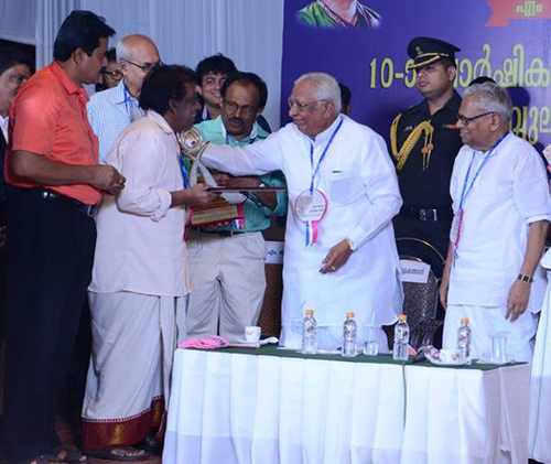Prof M.Subramoniasarma receiving Sri Krishna Sangeetharethna Award from Missoram Governor Mr.Vakk